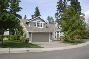 photo of a house with a new garage